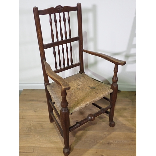 496 - Three antique rush seated Elbow Chairs, another with replacement solid seat and a single Chair