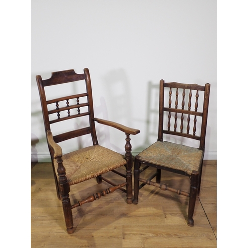 496 - Three antique rush seated Elbow Chairs, another with replacement solid seat and a single Chair