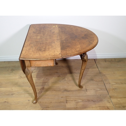 50 - A reproduction walnut dropleaf Table on carved cabriole supports and pad feet 3ft x 2ft 6in