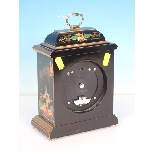 565 - An Elliott, London gilt and black lacquered Mantel Clock with chinoiserie decoration and carrying ha... 