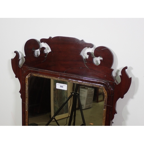 568 - A Georgian style mahogany Wall Mirror with scrolled fret carved frame, and gilt slip, 2ft 9in H x 1f... 