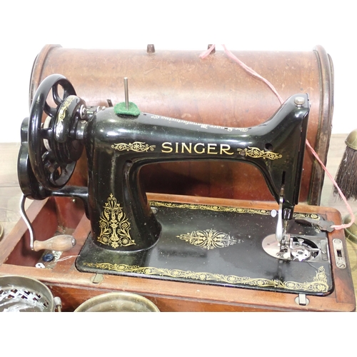 578 - A box of brass and a Sewing Machine