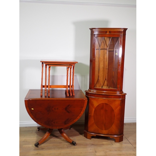 58 - A reproduction yew wood veneered dropleaf Table, Nest of three Occasional Tables and a Corner Cabine... 