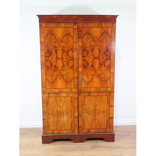 580 - A 19th Century walnut veneered two door Wardrobe 6ft 1in H x 3ft 8in W