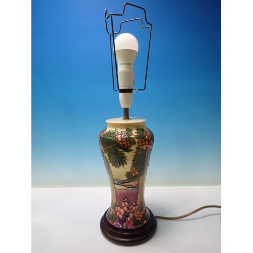 589 - A Moorcroft Table Lamp and shade with design of coconut palms on a beach, lamp base 11 1/2in H