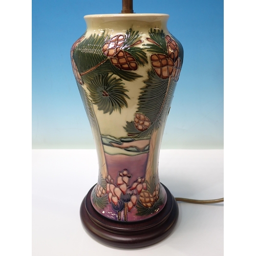 589 - A Moorcroft Table Lamp and shade with design of coconut palms on a beach, lamp base 11 1/2in H