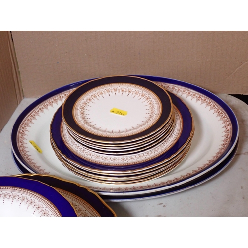 596 - A Royal Worcester part Dinner Service, with gilt rims and dark blue borders