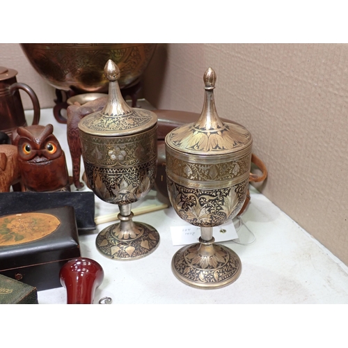 612 - A pair of Eastern metal Goblets and covers, a brass Bowl on stand, figures of Elephants, Boxes, mini... 