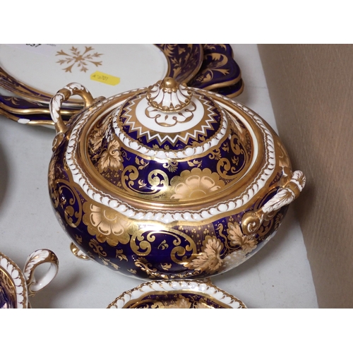 657 - A quantity of Crown Derby and other similar Teaware, with gilded decoration on a dark blue ground, s... 