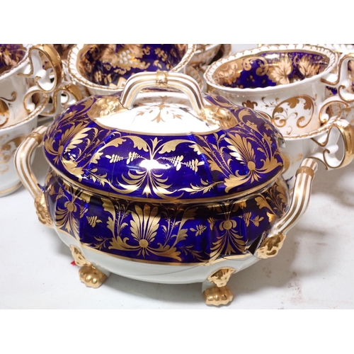 657 - A quantity of Crown Derby and other similar Teaware, with gilded decoration on a dark blue ground, s... 