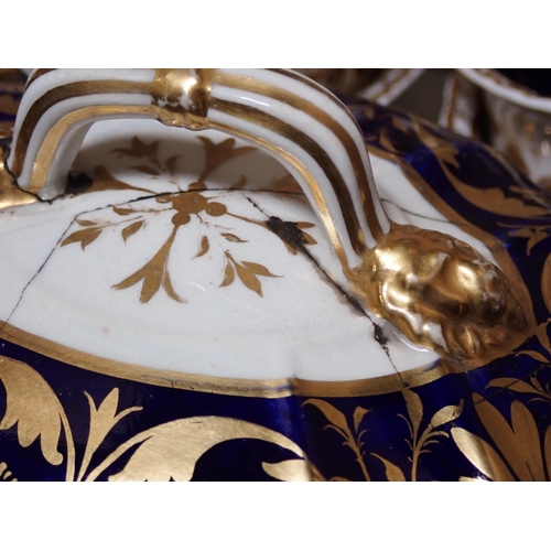 657 - A quantity of Crown Derby and other similar Teaware, with gilded decoration on a dark blue ground, s... 