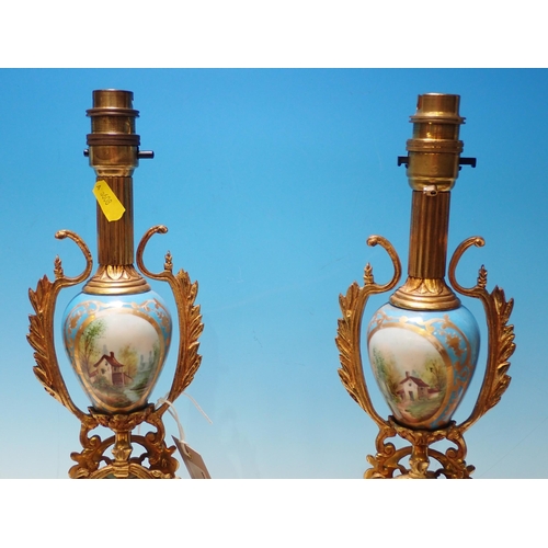 662 - A pair of brass and porcelain Table Lamps and a reproduction brass Lantern Clock