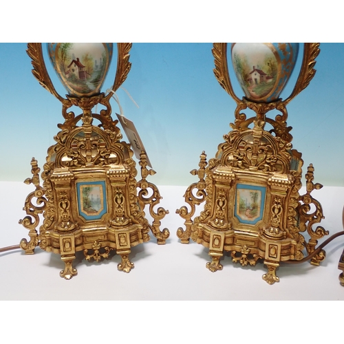 662 - A pair of brass and porcelain Table Lamps and a reproduction brass Lantern Clock