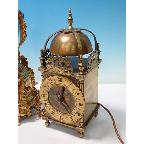 662 - A pair of brass and porcelain Table Lamps and a reproduction brass Lantern Clock