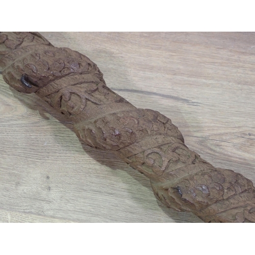 667 - A carved eastern Staff, 3ft 29in L