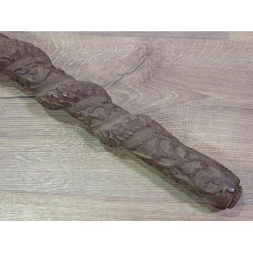 667 - A carved eastern Staff, 3ft 29in L