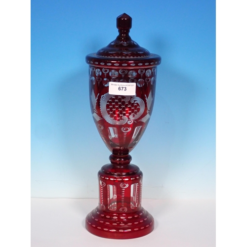 673 - A 19th Century Bohemian ruby flashed lidded Urn