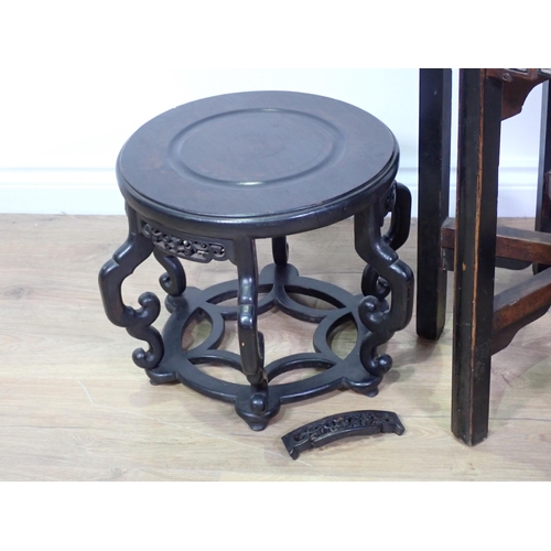 687 - An antique Chinese hardwood Jardinière Stand with rattan top and pierced frieze mounted on square cu... 