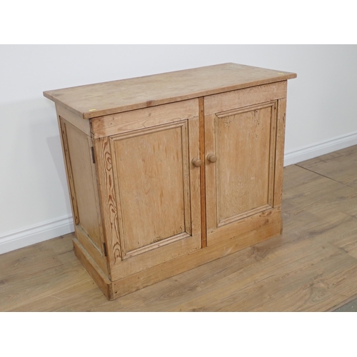 695 - A Victorian pine Cupboard fitted pair of panel doors on plinth base 3ft 4in W x 2ft 9in H