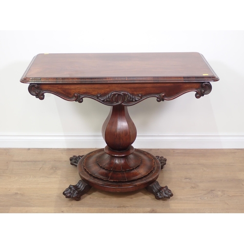 696 - A William IV rosewood Centre Table with moulded rectangular top upon octagonal baluster column, circ... 