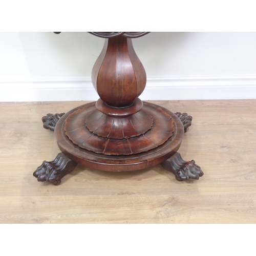 696 - A William IV rosewood Centre Table with moulded rectangular top upon octagonal baluster column, circ... 