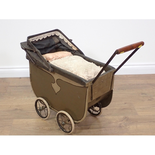 712 - A vintage child's Pram 2ft 5in L x 1ft 11in H