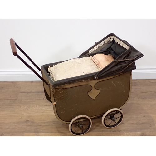 712 - A vintage child's Pram 2ft 5in L x 1ft 11in H