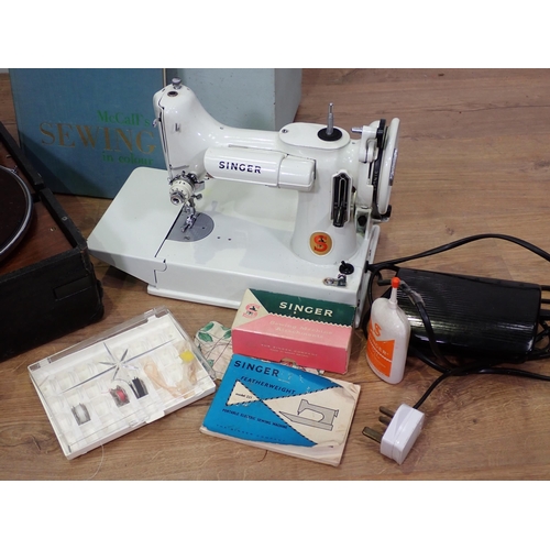 723 - A Singer Sewing Machine, Record Player and McCalls 'Sewing in Colour'