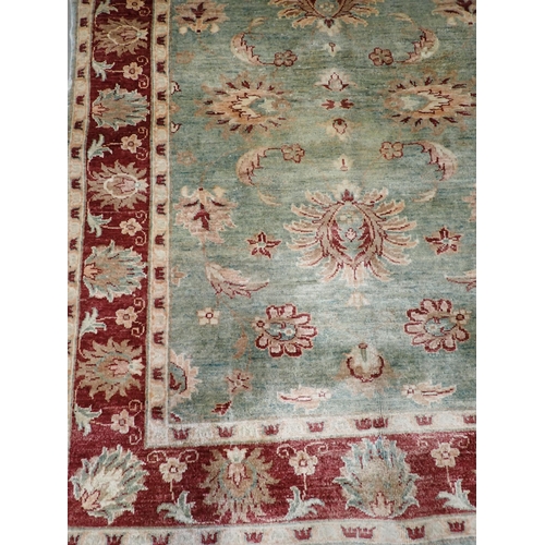 728 - A pale blue ground modern Rug with red border 5ft 7in L x 4ft W and a beige ground Rug 5ft 11in L x ... 