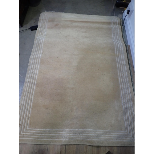 728 - A pale blue ground modern Rug with red border 5ft 7in L x 4ft W and a beige ground Rug 5ft 11in L x ... 