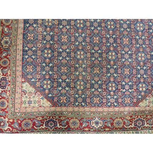 731 - A blue ground Persian Rug with tramline border 7ft 2in L x 4ft 7in W