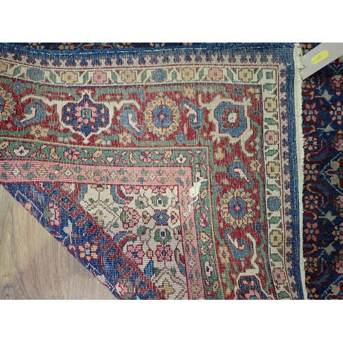 731 - A blue ground Persian Rug with tramline border 7ft 2in L x 4ft 7in W