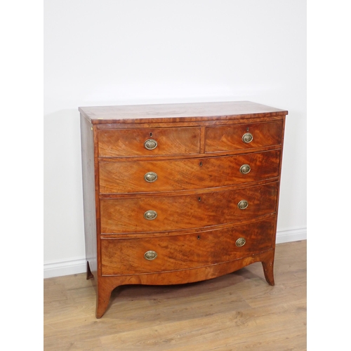 742 - A 19th Century mahogany bow front Chest of two short and three long drawers mounted upon splayed fee... 