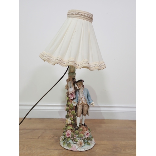 744 - A ceramic floral encrusted Table Lamp and shade of a gentleman in period costume A/F