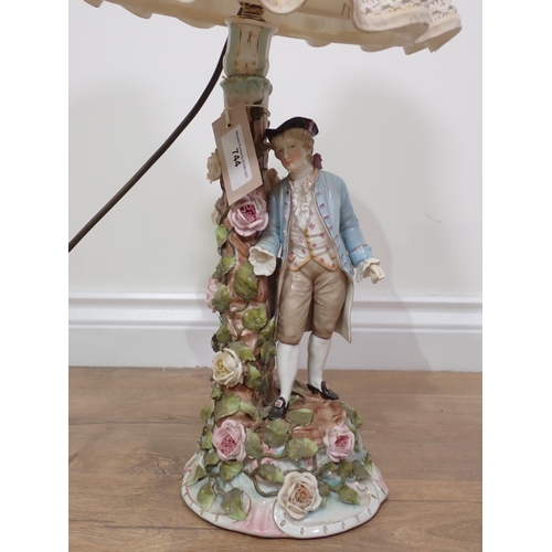 744 - A ceramic floral encrusted Table Lamp and shade of a gentleman in period costume A/F