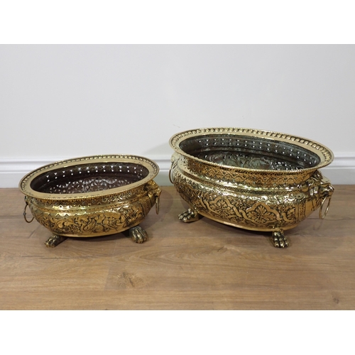 752 - Two 19th Century pierced copper graduated oval Planters with ball rim, lion mask ring handles and mo... 