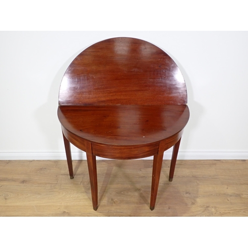 753 - A 19th Century mahogany demi-lune fold over Tea Table on square cut tapering supports 2ft 11in W x 2... 