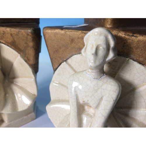 756 - A pair of pottery Candle Stands in the form of kneeling women