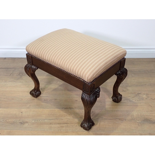 769 - A Georgian style mahogany Footstool with pink cushioned upholstery mounted upon carved cabriole supp... 