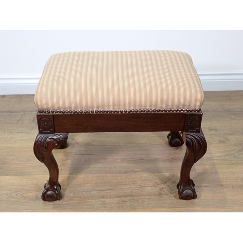 769 - A Georgian style mahogany Footstool with pink cushioned upholstery mounted upon carved cabriole supp... 