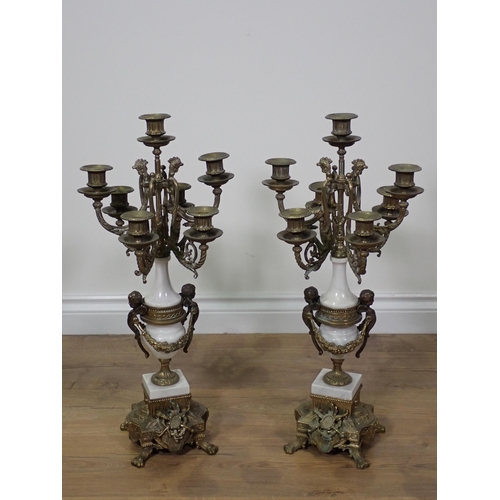 773 - A pair of marble effect and gilt brass seven branch Table Candelabra on ornate bases with paw feet 2... 