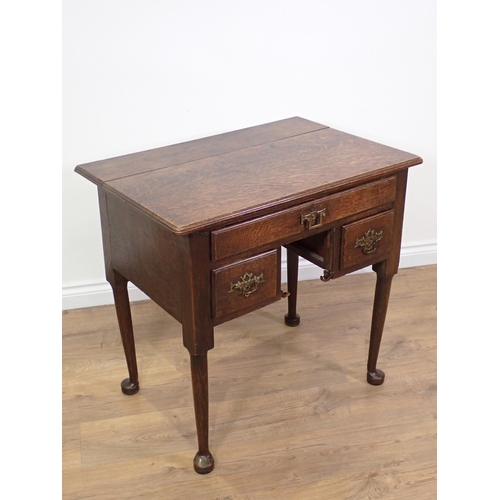 774 - An 18th Century oak Lowboy with moulded top fitted three drawers mounted on pad feet 2ft 7in W x 2ft... 