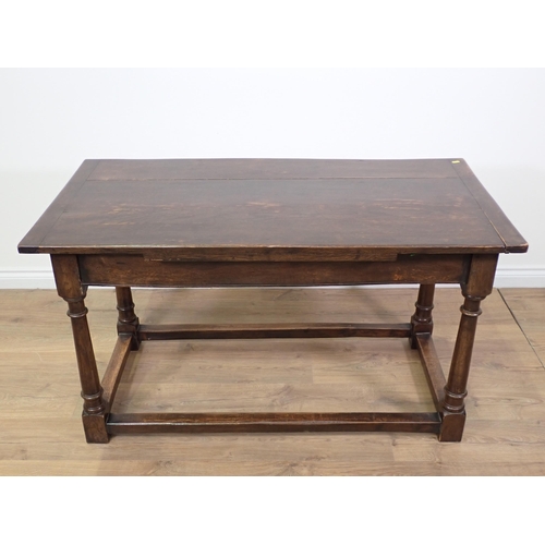 779 - An oak Refectory Table in the 17th Century style with cleated plank top on turned supports with surr... 