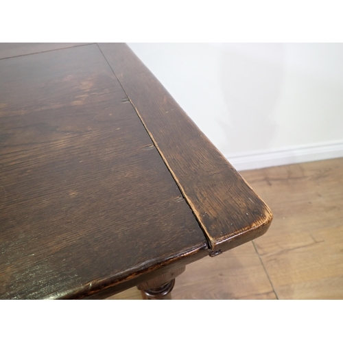 779 - An oak Refectory Table in the 17th Century style with cleated plank top on turned supports with surr... 