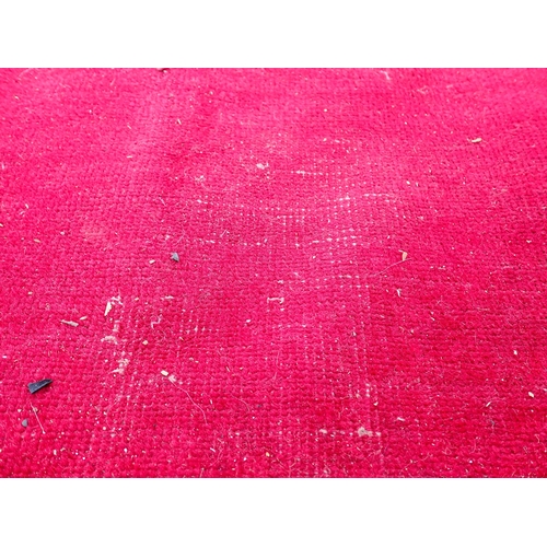 788 - A large Chinese red ground Carpet with blue central floral lozenge and broad borders 13ft L x 10ft W... 