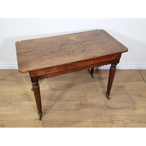 792 - A 19th Century oak Centre Table with shaped apron mounted upon fluted tapering supports and casters ... 