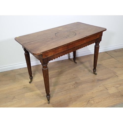 792 - A 19th Century oak Centre Table with shaped apron mounted upon fluted tapering supports and casters ... 