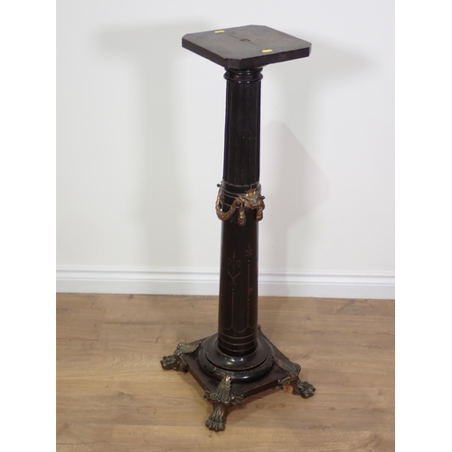 808 - An antique ebonised Torchere with gilt metal swag decoration and paw feet (woodworm) 3ft 3in H