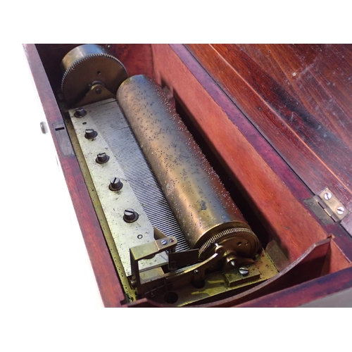 810 - A 19th Century rosewood and inlaid Music Box playing four airs (airs label present but not attached)... 