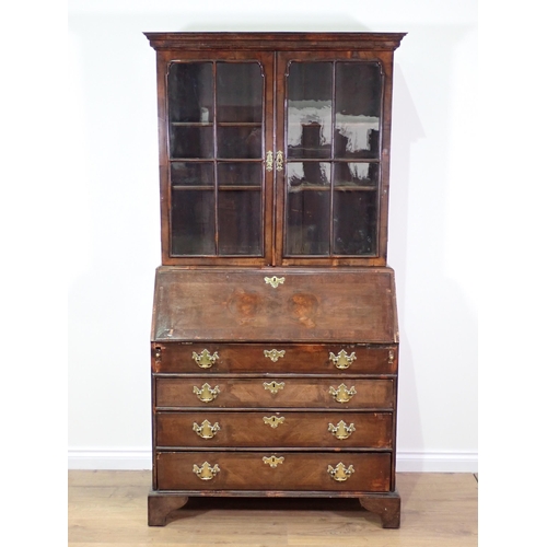 831 - A Georgian walnut Bureau Bookcase with glazed upper section above base fitted fall front enclosing f... 